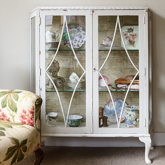 living room with white wall and upcycled cabinet