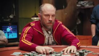 John Malkovich looking at a pile of poker chips in Rounders