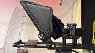 Side view of the Neewer Teleprompter X14 III in a large TV studio