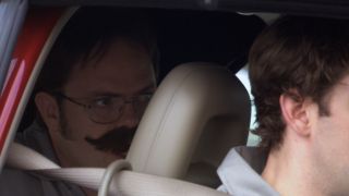 Dwight in the car with a mustache in The Office