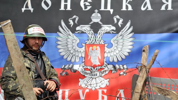 A pro-Russia activist stands guard in the city of Slavyansk