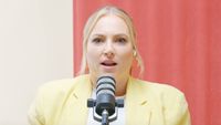 Meghan McCain speaking into microphone for podcast Citizen McCain