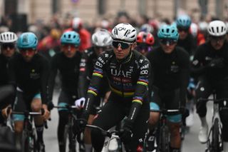 Team UAE's Slovenian rider Tadej Pogacar, rides to the start of the Milan - Sanremo one-day classic cycling race, in Pavia, near Milan, on March 22, 2025. (Photo by Marco BERTORELLO / AFP)