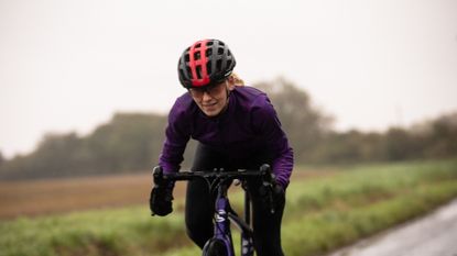 Female cyclist riding outside during the winter