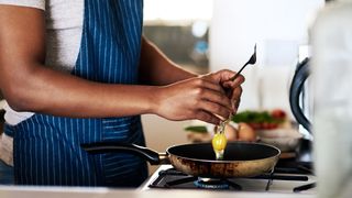 Man cooking with eggs, one of the best eye health foods