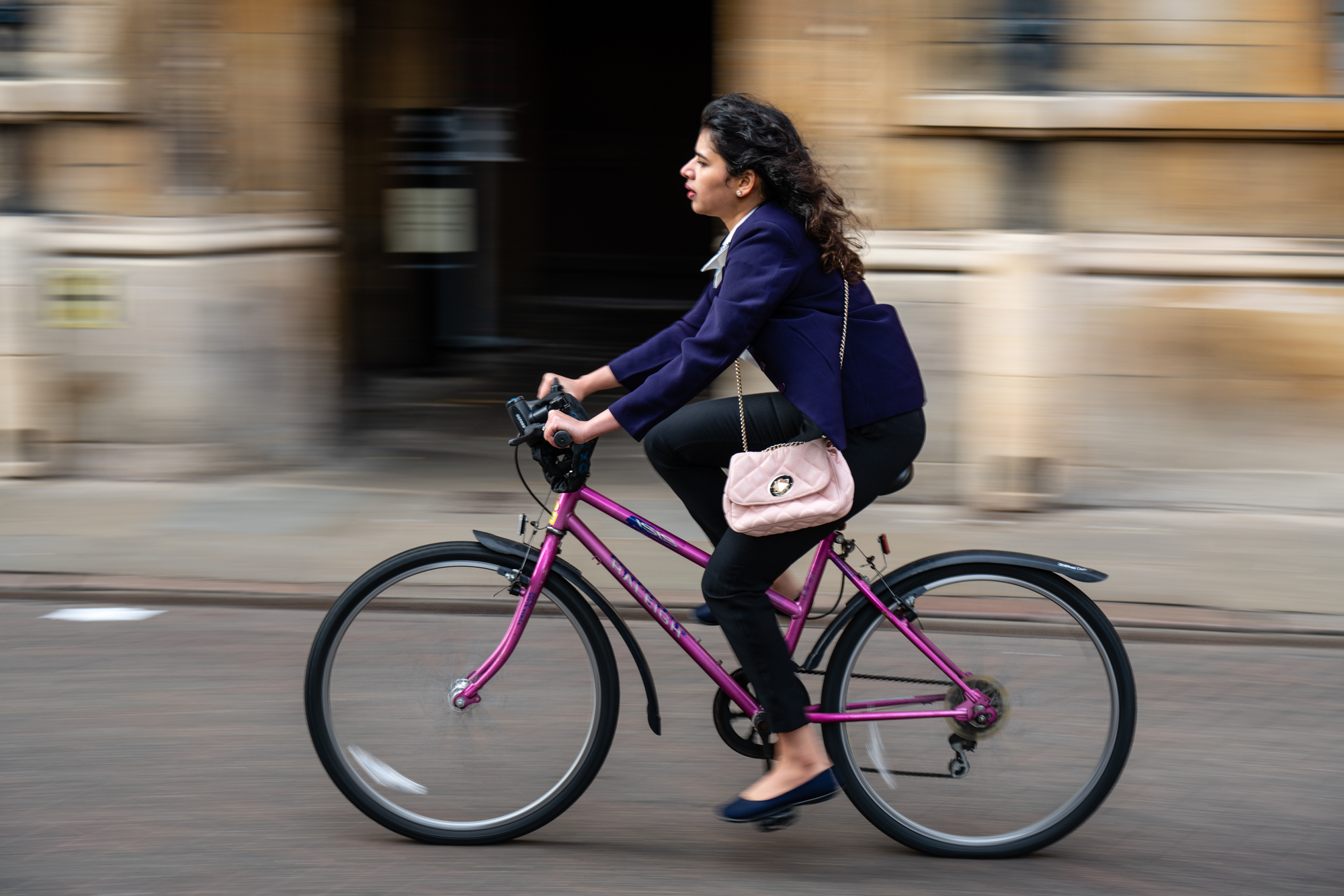 A person cycling through a city