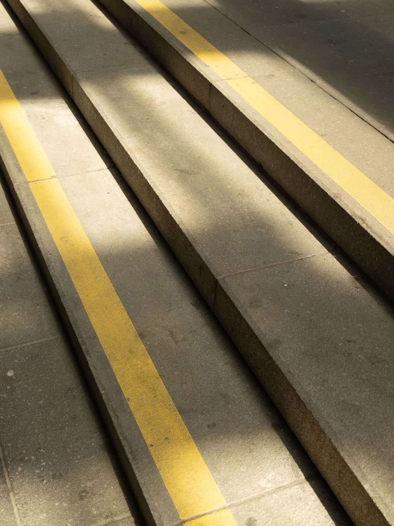 stone steps with yellow saftey lines painted on
