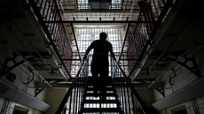 A prisoner walks up the steps of Reading Prison