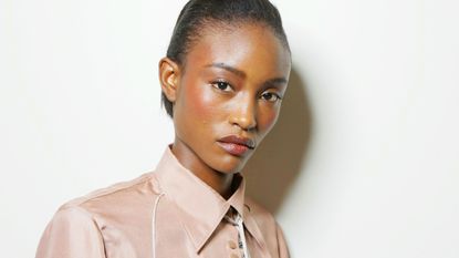 model with glowing skin after using a lightweight moisturizer