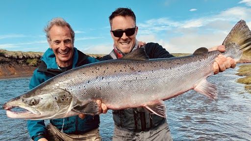 Robson and Jim’s Icelandic Fly-Fishing Adventure: Robson Green and Jim Murray holding a Wild Atlantic Salmon.