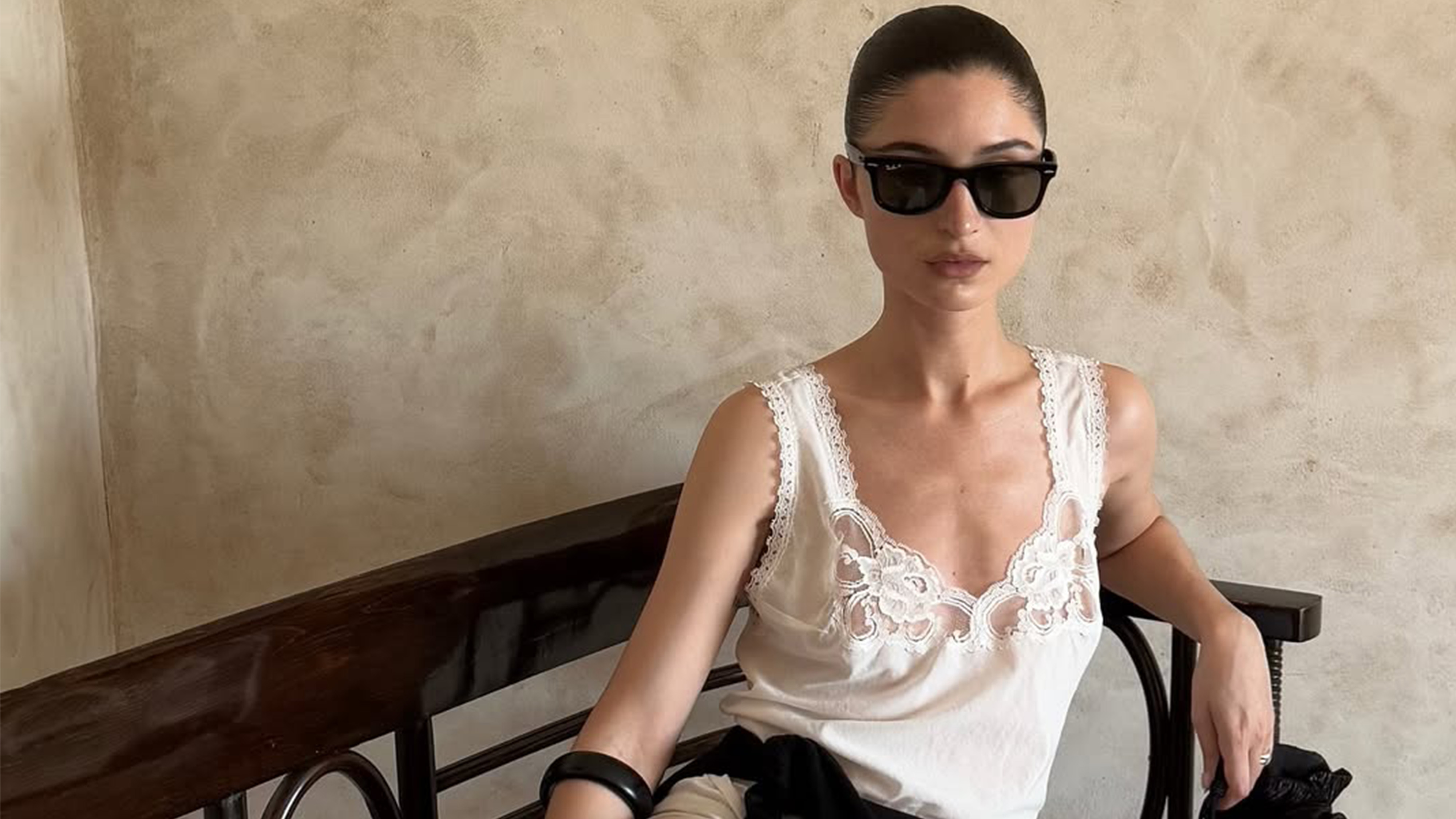 Andrea Ricci wearing a white dress.