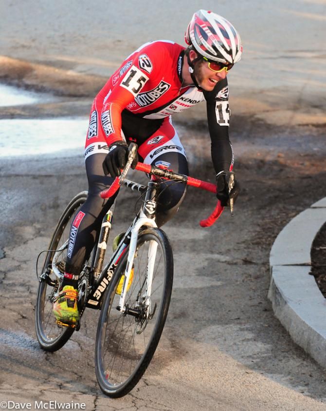 Jake Wells (Stan's NoTubes) riding in the top ten on one of the pavement sections of the course