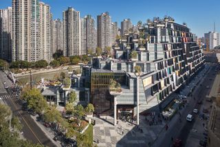 Side exterior view in the daylight of Thomas Heatherwick's 1000 Trees development in Shanghai