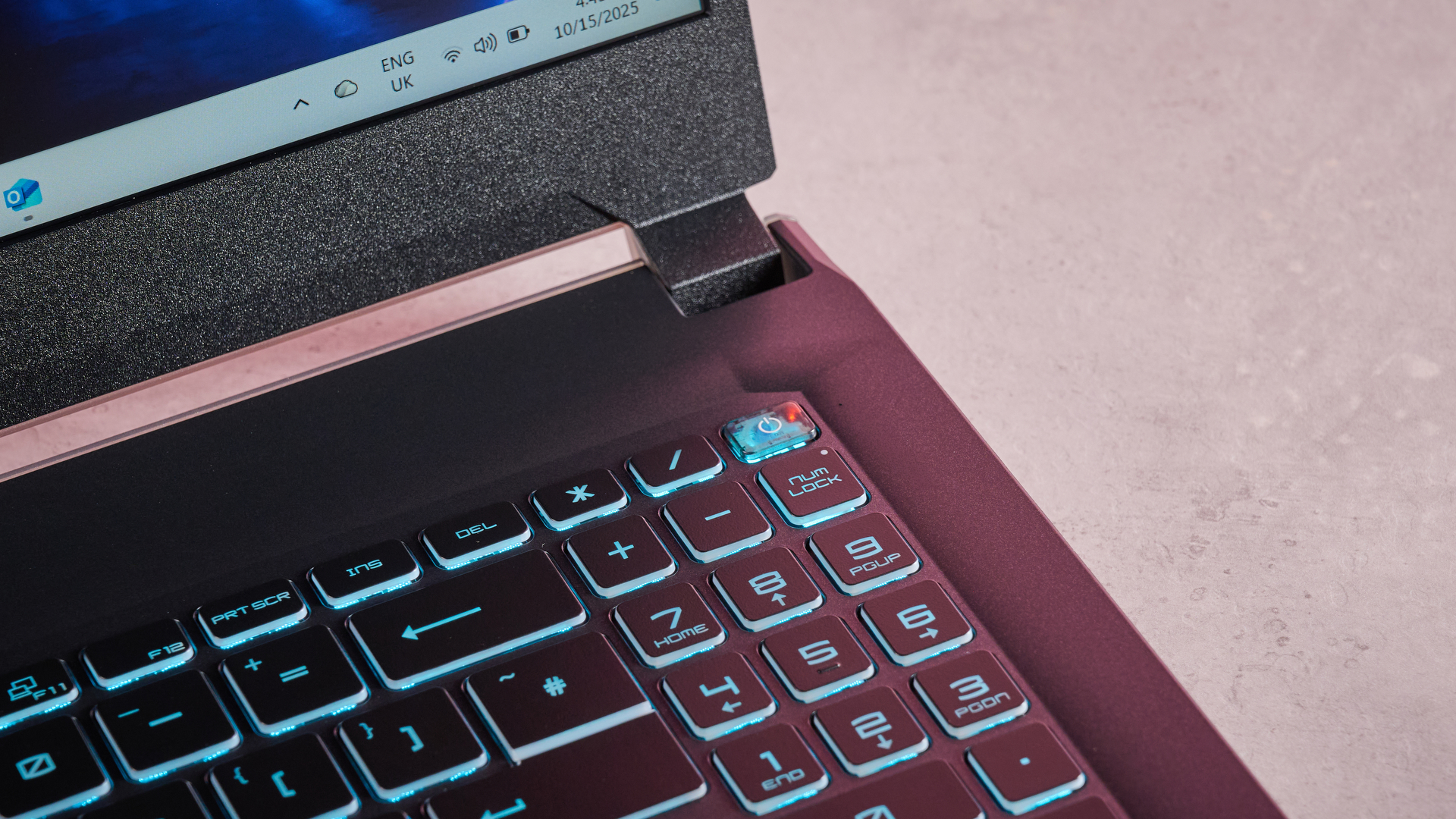 Close-up of number pad with blue backlighting on the MSI Cyborg 15, on a desk