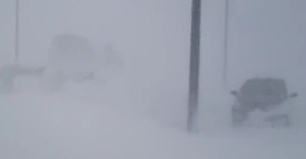 Blizzard in Amarillo whites out parking lot.