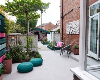 garden reveal from Your Garden Made Perfect with planters and outdoor seating