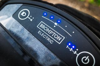 The status indicator lights of a Brompton battery glow blue