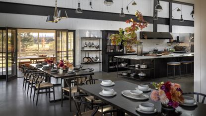 A large dining area with double height ceilings in a barn conversion 