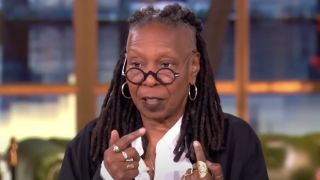 Whoopi Goldberg pointing fingers in The View