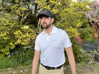 Monty wearing the white textured lightweight polo