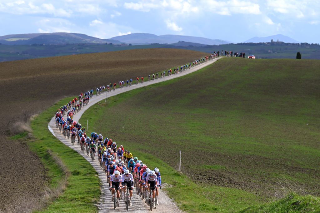 SIENA ITALY MARCH 02 Tadej Pogacar of Slovenia Tim Wellens of Belgium and Domen Novak of Slovenia and UAE Team Emirates lead the peloton during the 18th Strade Bianche 2024 Mens Elite a 215km one day race from Siena to Siena 320m UCIWT on March 02 2024 in Siena Italy Photo by Tim de WaeleGetty Images