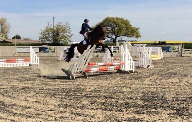 &ldquo;This is a picture of Coolio at one of his first showjumping shows where he attempted to jump the jump wing rather than the poles. We both recovered well and completed the rest of the course successfully!&rdquo; &mdash; Laura Smith
