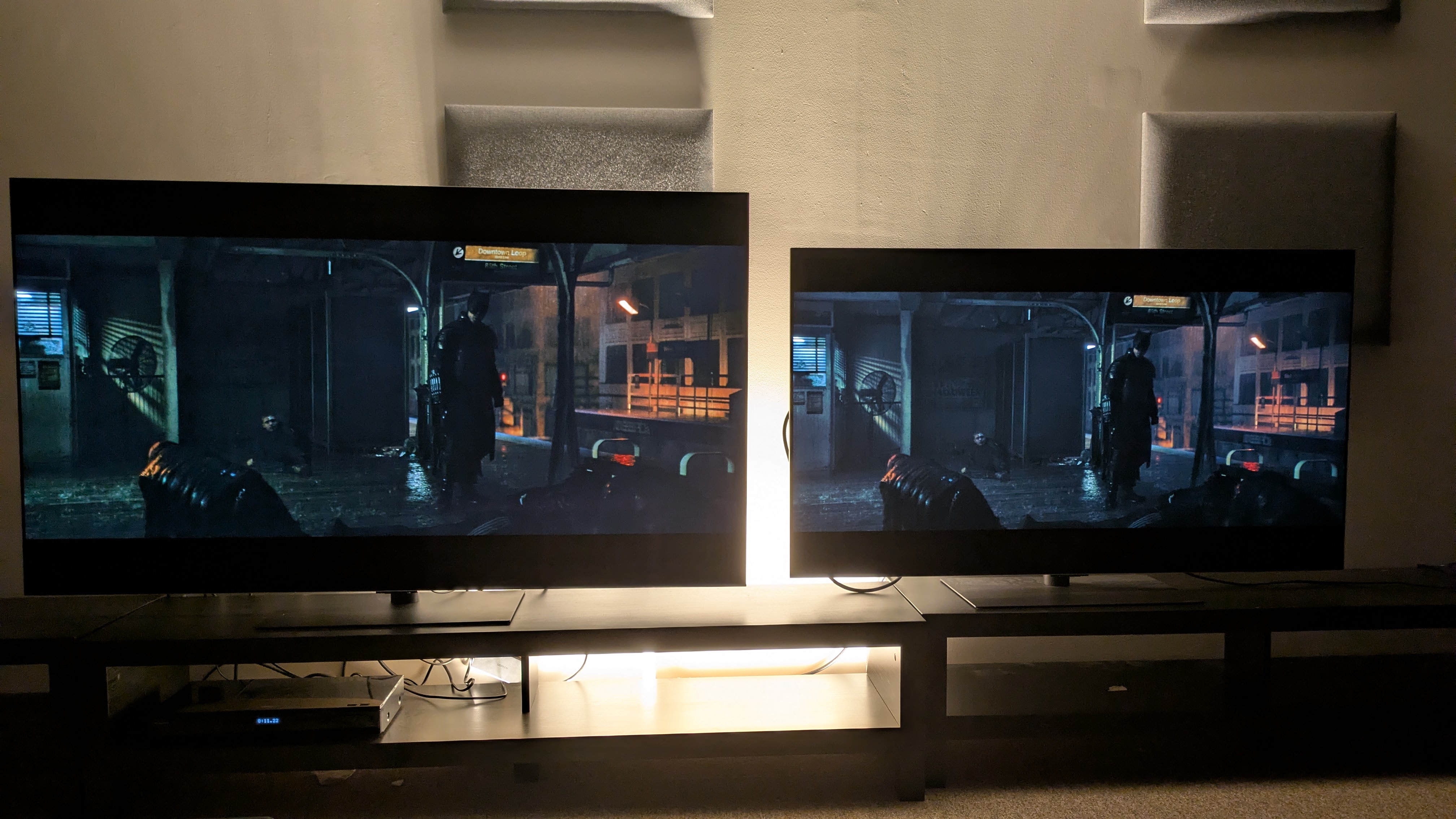 The LG G6 (left) and LG G5 (right) showing Batman on a subway platform post fight from The Batman. The G5 looks brighter with slightly raised dark tones whereas the G6 has deeper blacks and a better contrast balance
