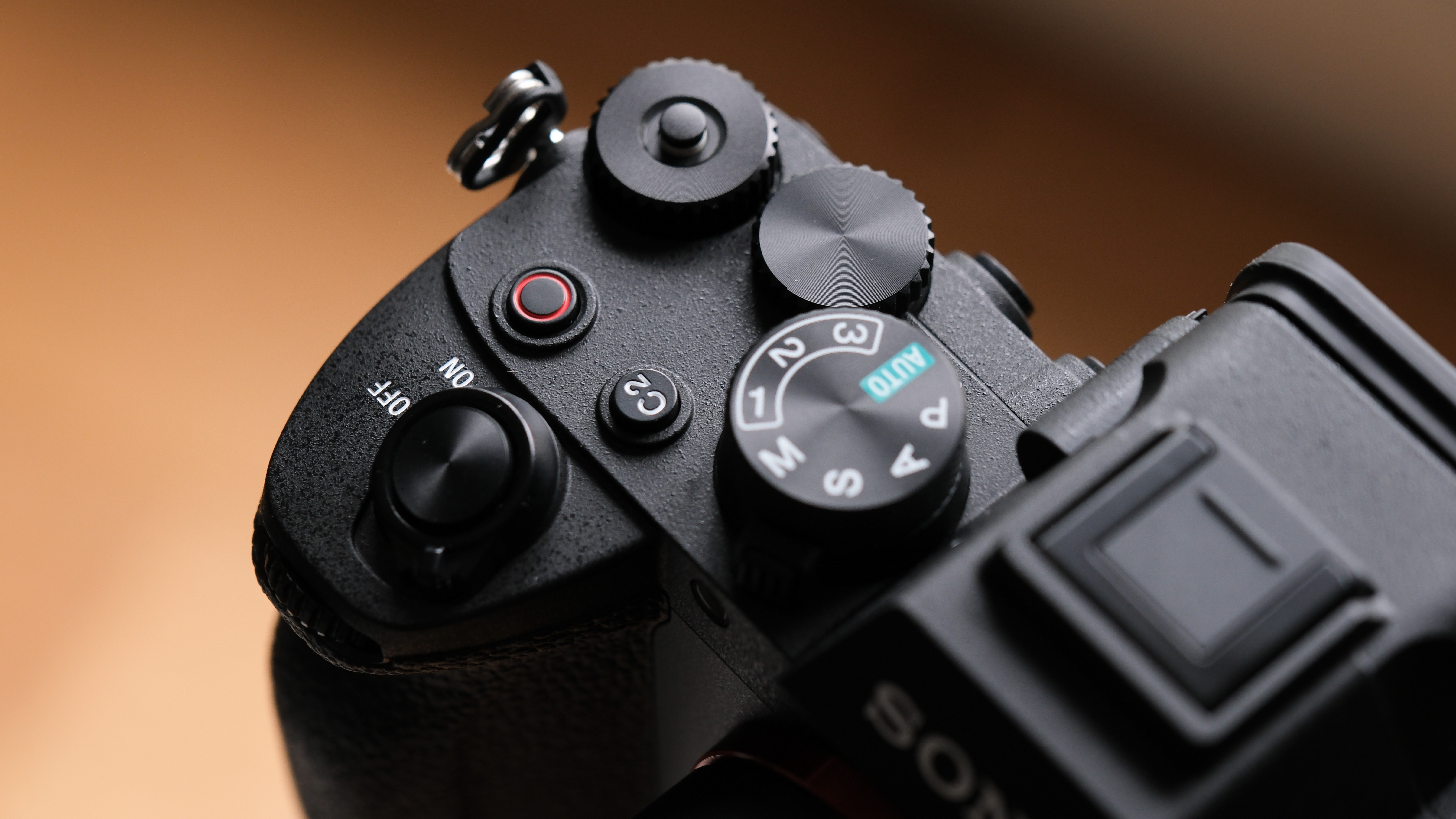 Close up of the control dials on a Sony A7 V camera