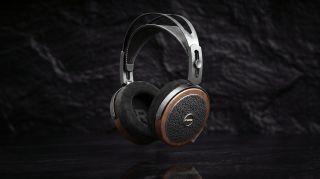 FiiO FT15 wired planar magnetic headphones in black walnut on a black background