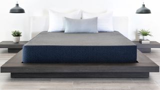 The Brooklyn Bedding Dreamfoam Essential on a wooden bed base in a modern bedroom