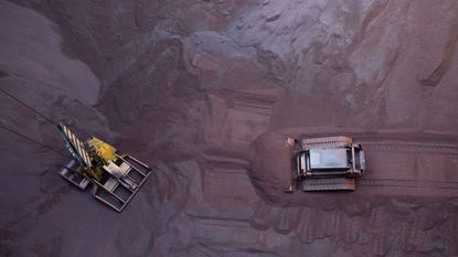 Loading of iron ore on a barge at Saldanha Bay, South Africa