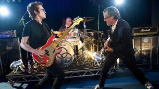 Glenn Hughes with his 1957 Fender Precision Bass, Jason Bonham and Joe Bonamassa with his Signature Gibson Les Paul guitar, of Black Country Communion at their first ever live performance, in John Henry Studios in London, September 20, 2010.