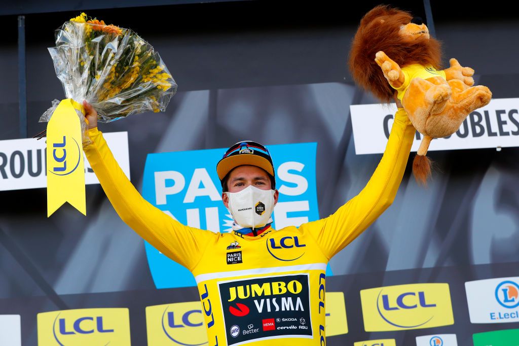 CHIROUBLES FRANCE MARCH 10 Podium Primoz Roglic of Slovenia and Team Jumbo Visma Yellow Leader Jersey Celebration during the 79th Paris Nice 2021 Stage 4 a 1875km stage from ChalonSurSane to Chiroubles 702m Mask Covid safety measures Trophy Flowers Lion Mascot ParisNice on March 10 2021 in Chiroubles France Photo by Bas CzerwinskiGetty Images