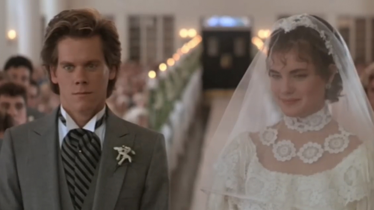 Kevin Bacon on the left in a morning suit, with Elizabeth McGovern in a bride's dress in She's Having A Baby