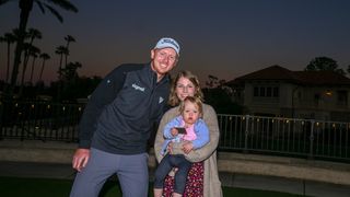 Hayden Springer poses with his family and his PGA Tour card for 2024 following Q-School