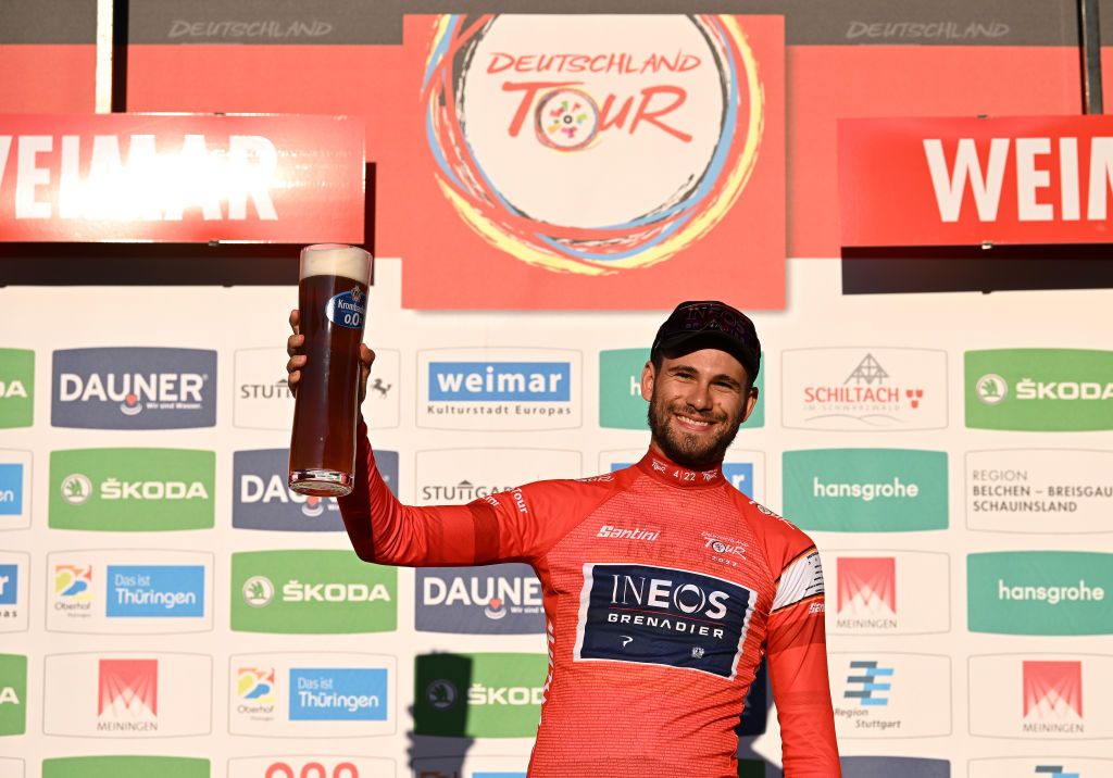 WEIMAR GERMANY AUGUST 24 Filippo Ganna of Italy and Team INEOS Grenadiers celebrates at podium as Red Leader Jersey winner during the 37th Deutschland Tour 2022 Prologue a 26km individual time trial from Weimar to Weimar DeineTour on August 24 2022 in Weimar Germany Photo by Stuart FranklinGetty Images