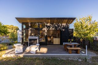 An outdoor space with furniture of different materials