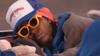 T&#039;Kor sleeping with sunglasses in the Big Brother house. 