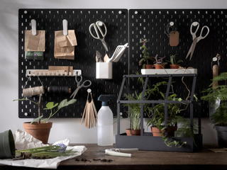 The IKEA Skadis pegboard is the perfect organization tool for your plants