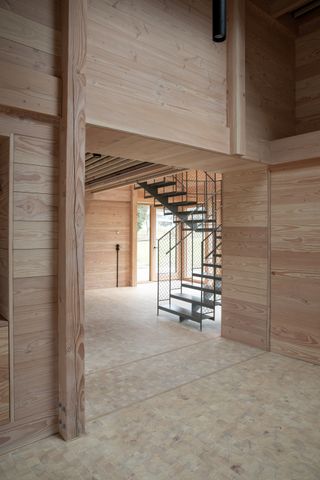 Timber interior with main staircase at House of Nature by Revaerk Arkitektur