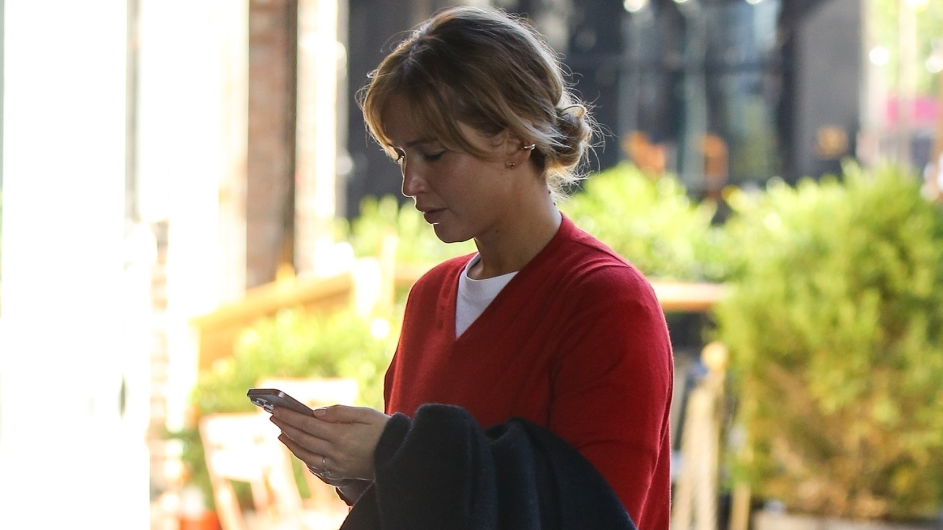 Jennifer Lawrence was spotted in NYC looking every bit a French girl in a red sweater, jeans, and loafers