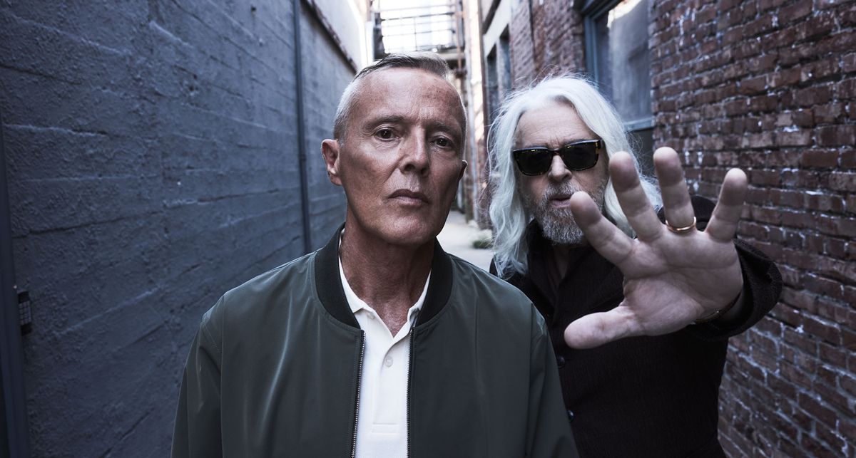 A colour portrait of Tears For Fears&#039; Roland Orzabal and Curt Smith, shot in an alleyway