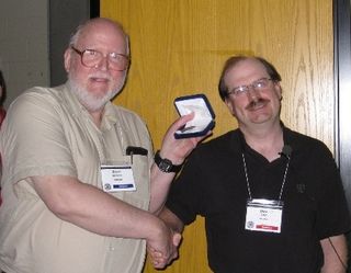 Geoff Gaherty (on left) receiving 2008 Chant Medal from. RASC President Dave Lane.