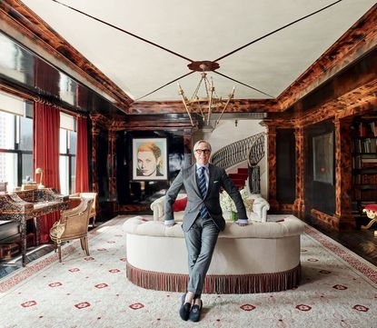 Hilfiger in the living room of his duplex penthouse at New York’s Plaza Hotel, with Warhol’s Grace Kelly