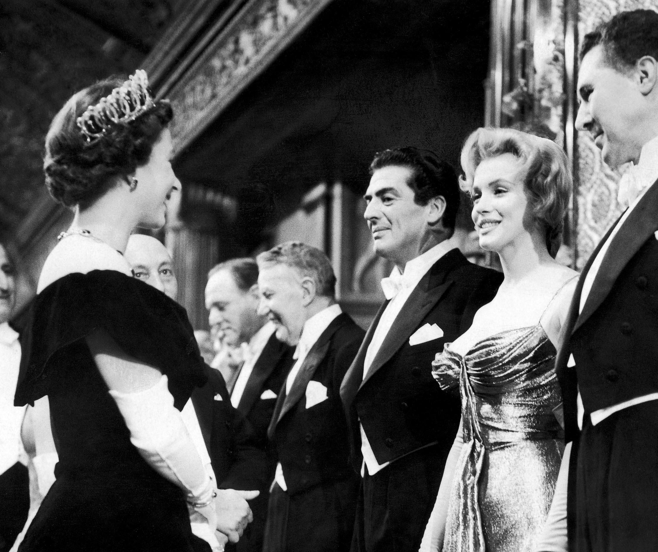 Marilyn Monroe meets Queen Elizabeth II at the Royal Command Film Performance at Leicester Square in London. 29th October 1956. (Photo by Daily Herald/Mirrorpix/Mirrorpix via Getty Images)