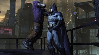 Batman holds a thug by the neck in Batman: Arkham City