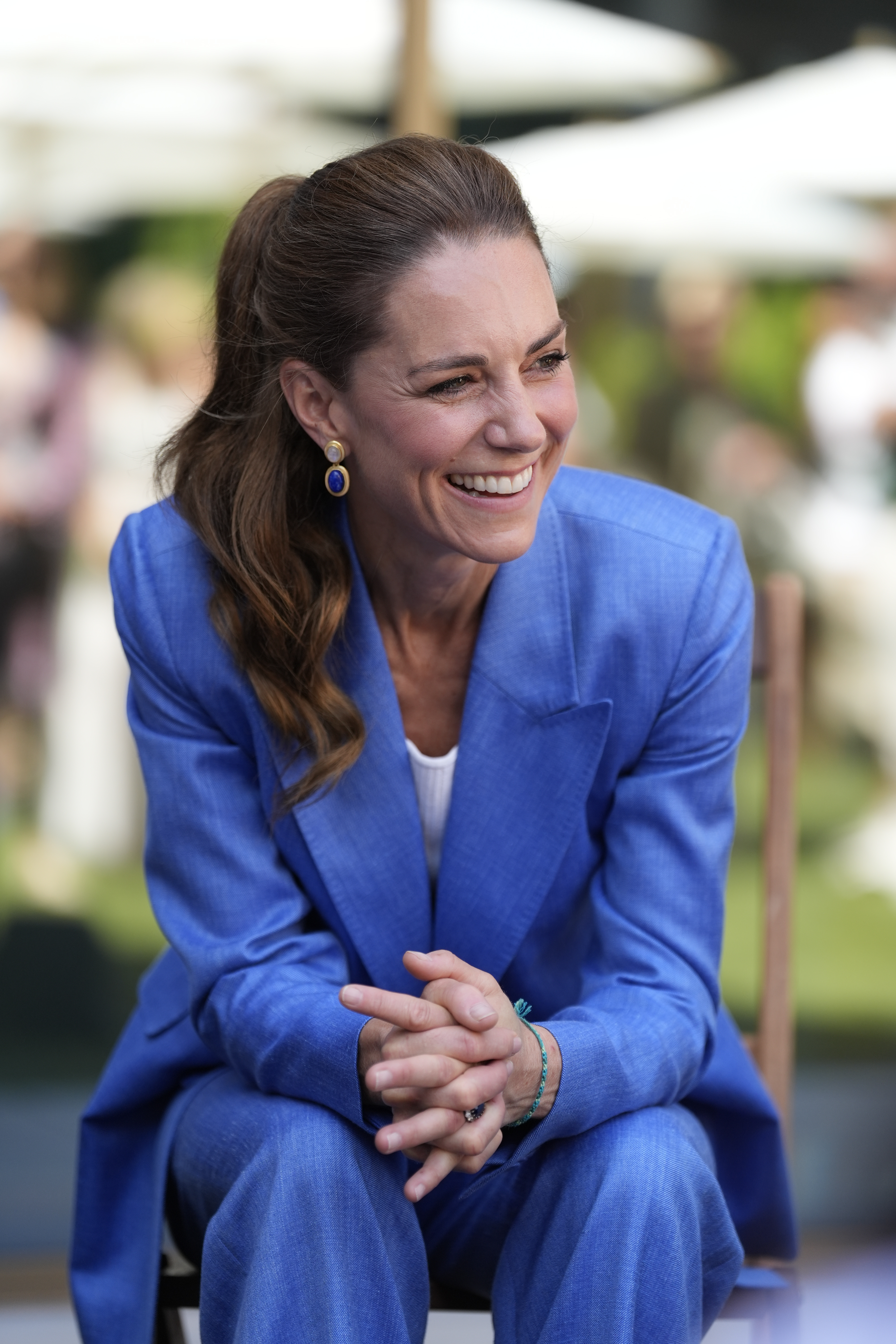Princess Kate sitting down in a blue suit