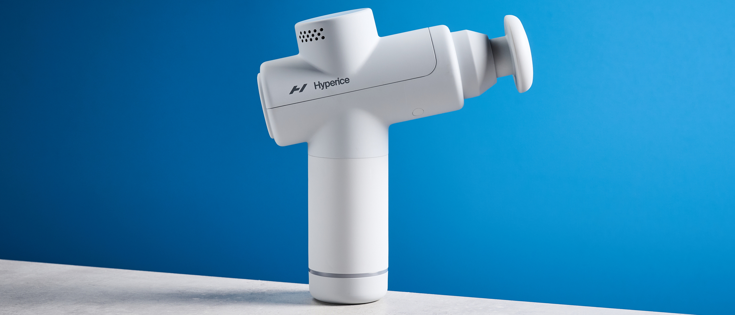 the hyperice hypervolt go 2 massage gun in white/gray with a bullet head attachment, flat head attachment, and a usb-c charging port