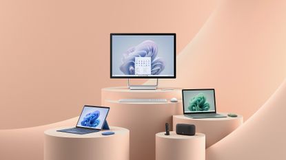 The new Microsoft Surface family presented against a salmon backdrop
