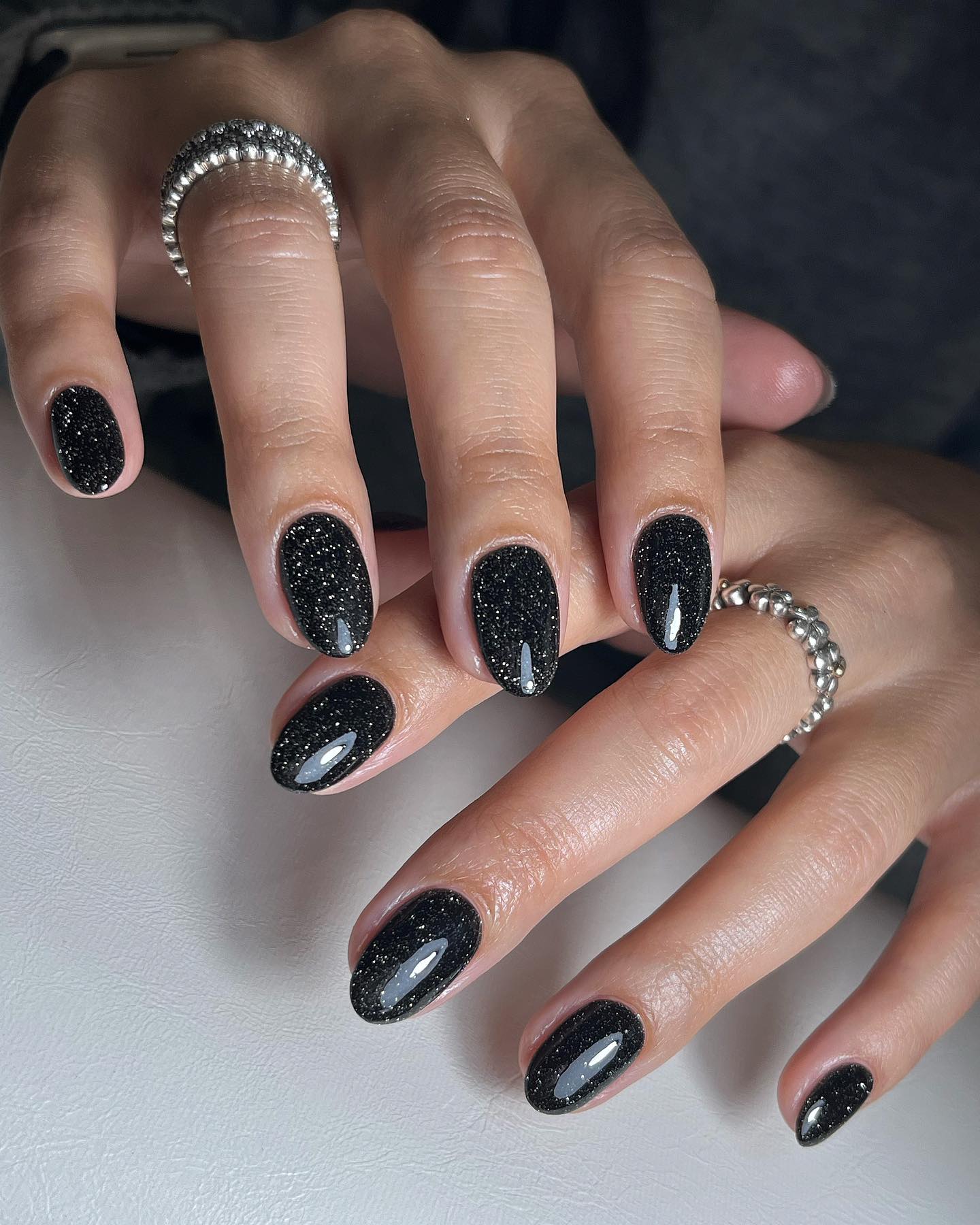 Black nail polish manicure design.